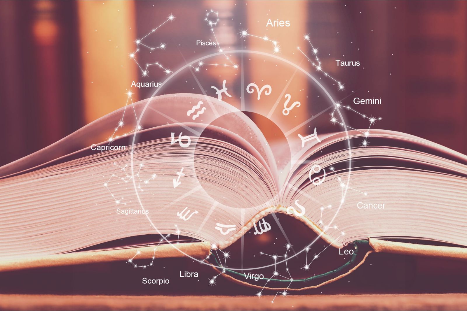 Livro aberto com ilustração dos signos