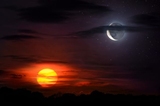 Encontro do sol e da lua no céu